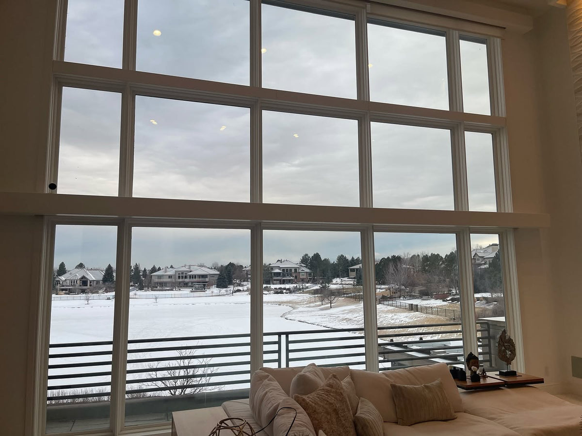 Living room with large windows window film no shades view 