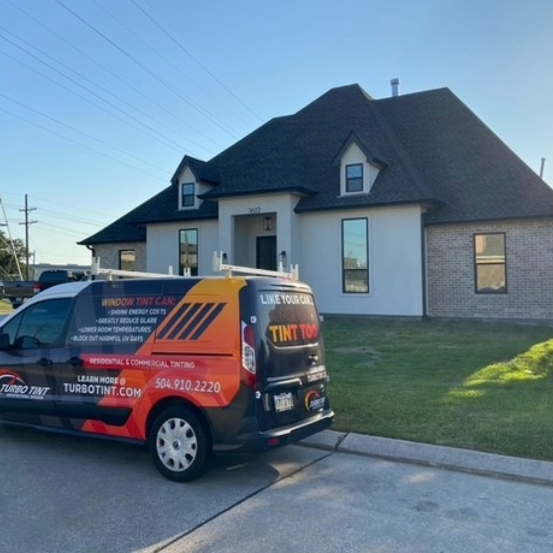 Turbo Tint van parked in front of a house protection from sun uv rays
